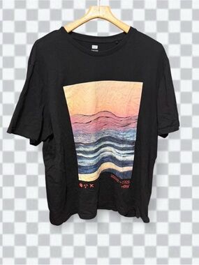 F&F (Tesco's clothing brand), featuring a pastel sunset and wave landscape tee